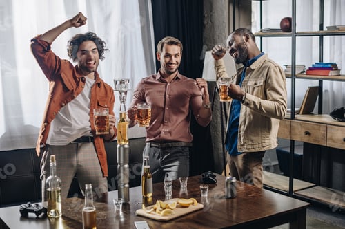 Preview: happy male friends cheering and drinking beer together