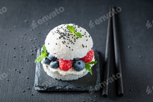 Preview: Sweet sush burger with mascarpone and berries on stone plate.
