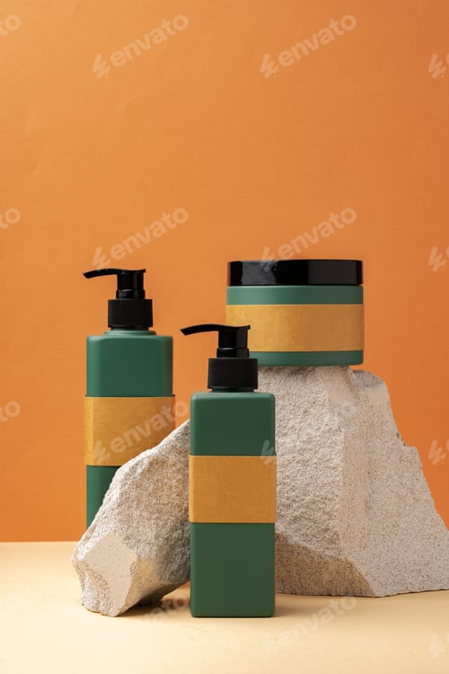 Preview: Dark green plastic bottles for skincare cosmetics on yellow background