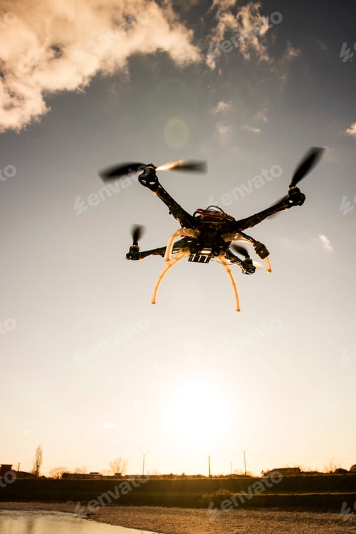 Preview: Quadrocopter in flight at sunset