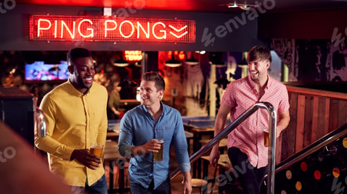 Preview: Three Male Friends Climbing Stairs As They Meet For Drinks And Socialize In Bar