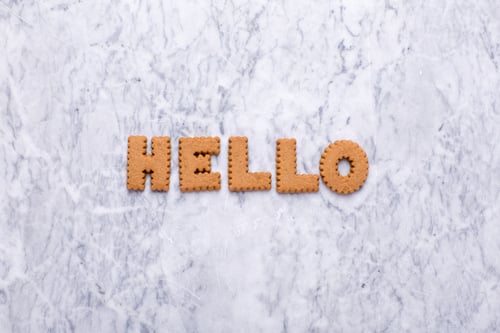 Preview: Letters tasy cookies Hello on marble background