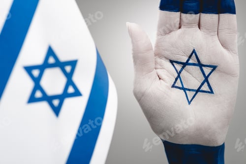 Preview: selective focus of female hand with star of david near flag on grey