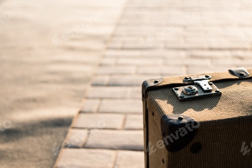 Preview: Close-up detail of an old vintage suitcase with blur background with copy space.
