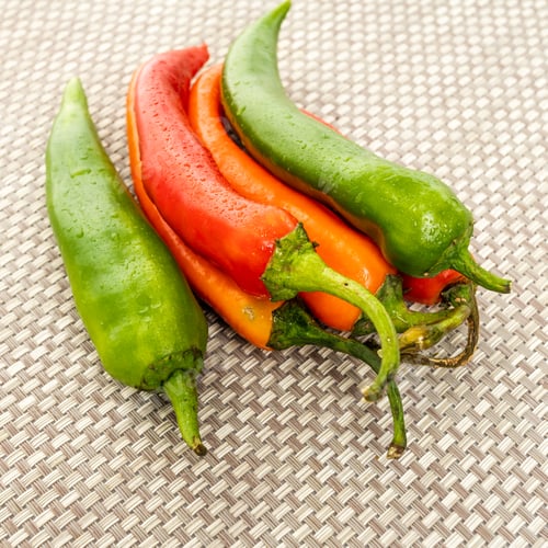 Preview: red hot chilly peppers on a table