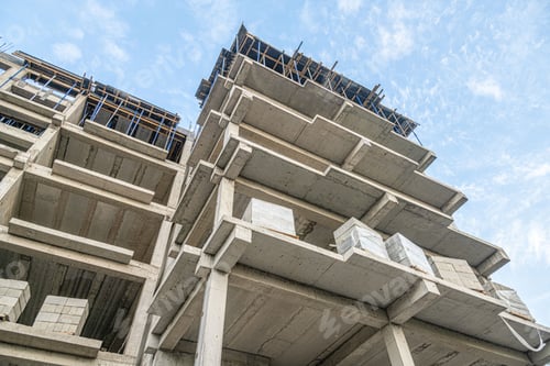 Preview: Low angle shot of a construction site with a new building infrastructure