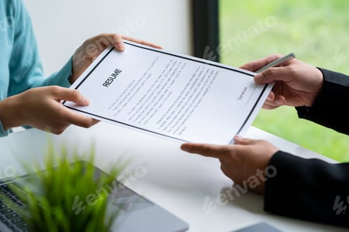 Preview: Human resources manager conducting job interview with applicant in the office, Candidate with resume