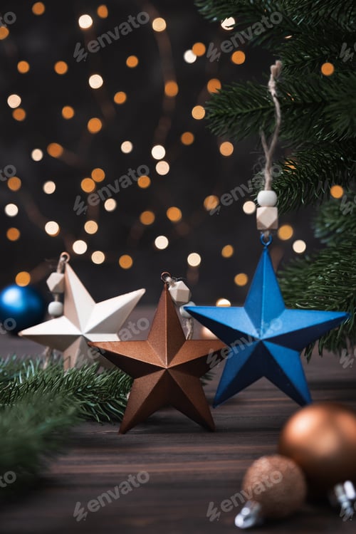 Preview: Christmas composition with blue and beige with decorations, fir tree branches on brown background.