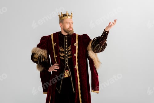 Preview: king with crown pointing with hand isolated on grey