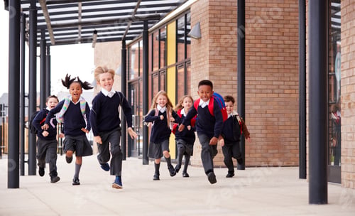 Preview: Primary school kids, wearing school uniforms and backpacks, running on a walkway