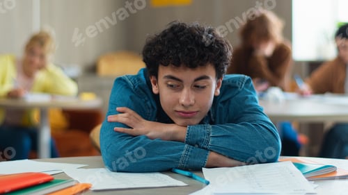 Preview: Tired sleepy napping exhausted fatigued overworked overload pupil teen boy teenager sleep student