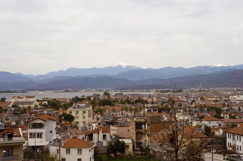 Preview: Beautiful view at roofs of houses incity of Fethie, Turkey, on background of mountains.