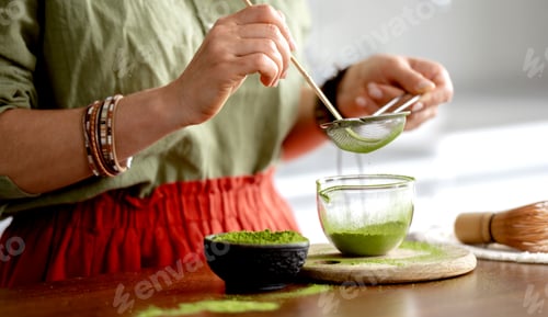 Preview: Woman Sifting Matcha Tea