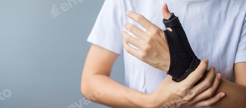 Preview: woman holding her wrist pain because using smartphone or computer long time.