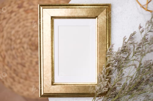 Preview: mockup gold photo frame on white stone round table with sunlight