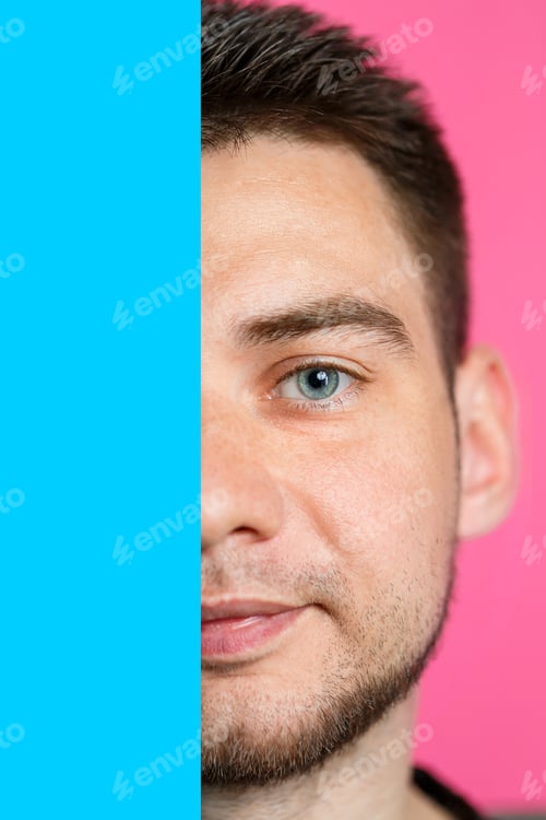Preview: A man is smiling and holding an empty cardboard blue banner over an isolated pink background
