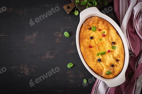 Preview: Breakfast. Appetizing cottage cheese casserole on dark table. Top view