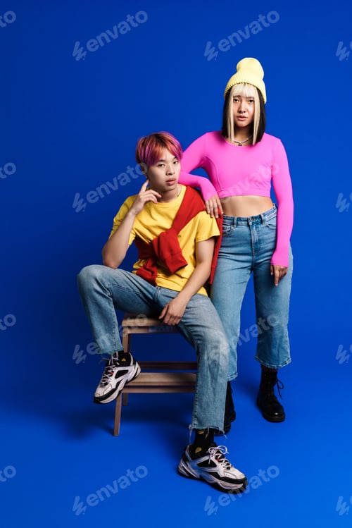 Preview: Asian couple with multicolored hair posing on camera