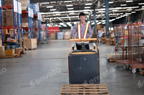 Preview: Warehouse worker pulling manual hand pallet lift