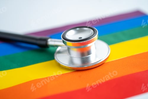 Preview: Black stethoscope on rainbow flag background, symbol of LGBT pride month celebrate annual in June