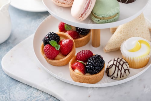 Preview: Spring or summer dessert table, three tiered tray with desserts