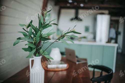 Vase of Greenery on a Wooden Table
