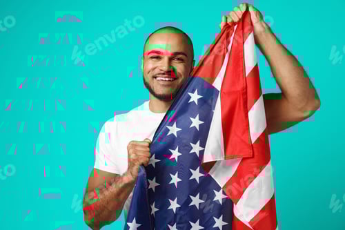 Preview: Portrait of young dark-skinned man proudly holding USA flag