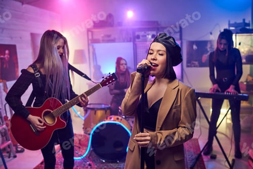 Preview: Young attractive woman singing in microphone on stage