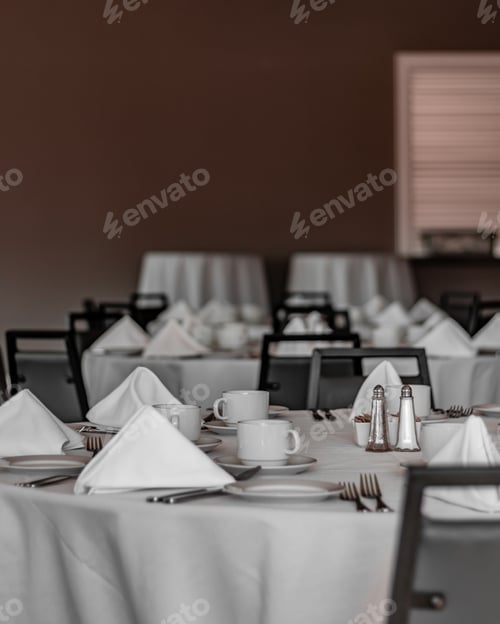 Preview: Vertical shot of neat tables in a nice, empty and clean restaurant