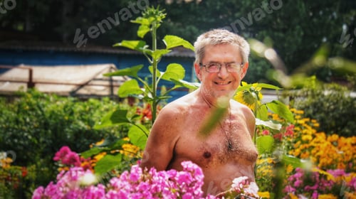 Preview: Man aged standing in flowers