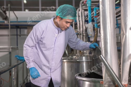 Preview: Worker Checking quality or checking stock of glass bottle in beverage factory.