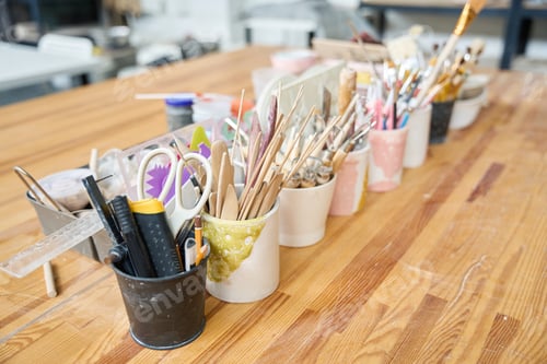 Preview: Sets of tools manual labor in cups on wooden table