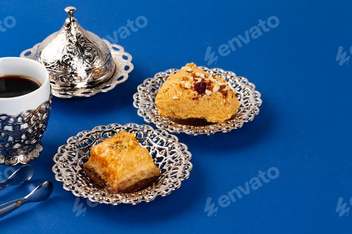 Preview: Halva dessert with tea cup on blue background