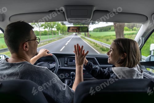Preview: Happy car ride. Driver and child. Joyful moment.