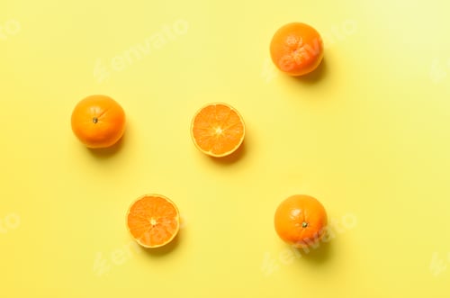 Preview: Fruit pattern of fresh orange slices on yellow background. Top view. Copy Space. Pop art design
