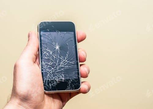 Preview: Hand holding broken phone