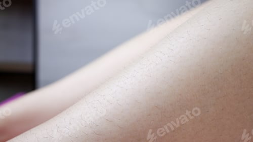 Preview: model's legs - close-ups showing black hair, which is removed by sugar epilation.