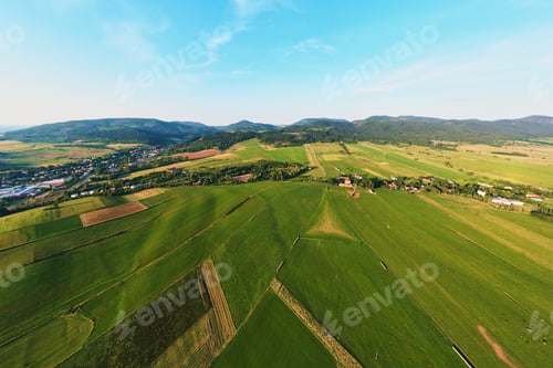 Preview: Mountains range and agricultural fields