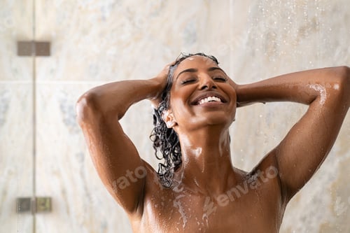 Preview: African woman washing hair under shower
