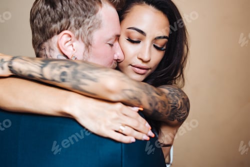 Preview: Beautiful, young couple posing on camera indoors