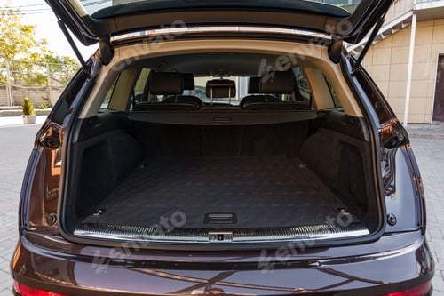Preview: Spacious car trunk with ample storage for travel or moving in clear surroundings