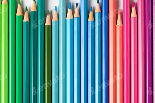 Preview: Composition of colorful crayons on white surface
