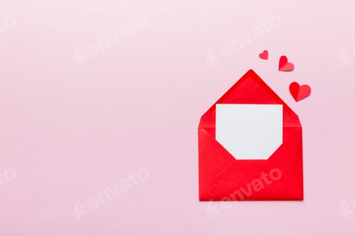 Preview: Red paper envelope with empty white card and heart on colored background. top view