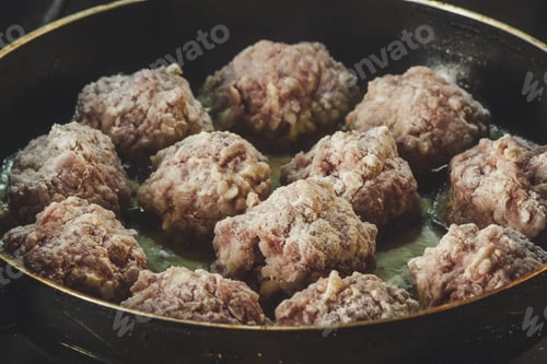 Preview: Meatballs In A Floury Bread Pan Are Fried In A Frying Pan In Oil