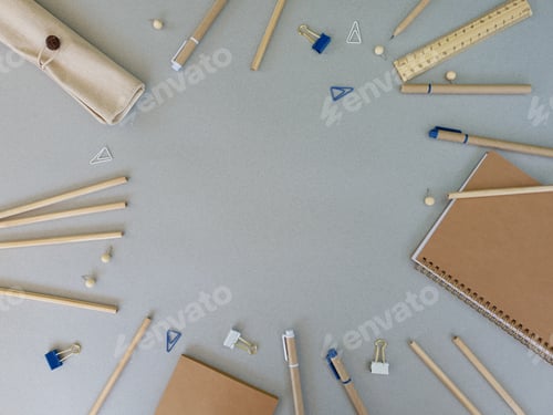 Preview: Office supplies are laid out on a gray background