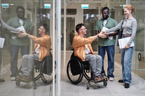 Preview: Colleagues greeting each other in office