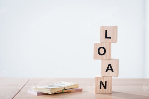 Preview: Loan Blocks and Money Stack on Wood Surface