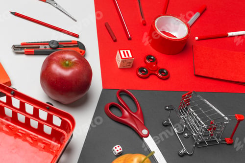 Preview: school supplies at colorful paper background