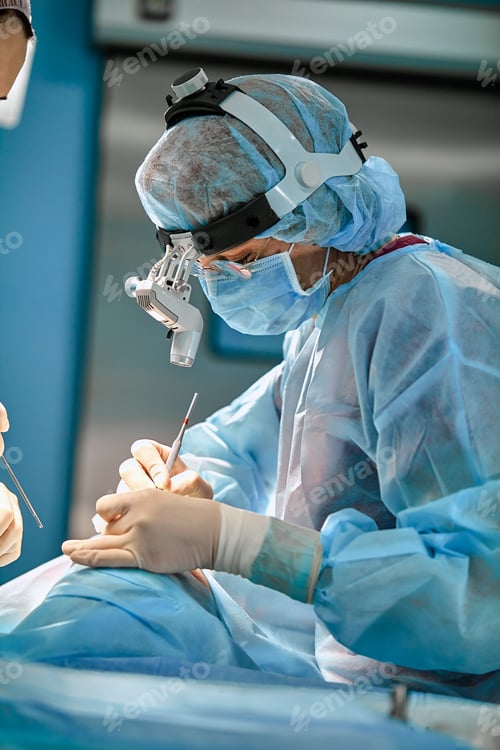 Preview: Surgical team in the operating room, close-up. An international team of professional doctors in a