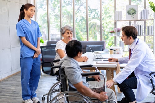 Preview: Senior couple male on wheel chair having consultations with doctor for their sickness at clinic